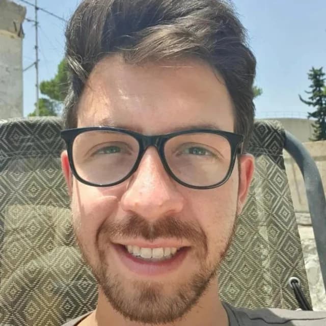 Daniel Rozin, founder and CMO of A Versus B, smiling outdoors